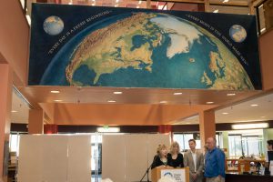 Kingman NYT mural dedicated at the Dale Clark Library, Maureen Waldron, and the Kingman daughters present.